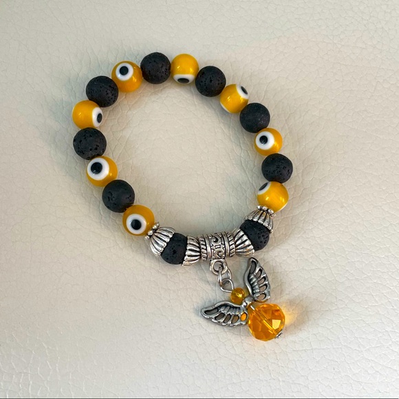 ๐ 2/$50 ๐ Yellow Angel Evil Eye Lava Bead Bracelet - Picture 1 of 1
